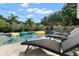 Outdoor space with refreshing pool, lounge chairs, and inviting floats for summertime relaxation at 6180 42Nd N Ave, St Petersburg, FL 33709