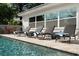 Inviting poolside area with lounge chairs offers a relaxing outdoor experience by the refreshing pool at 6180 42Nd N Ave, St Petersburg, FL 33709