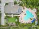 Overhead shot of clubhouse featuring resort-style pool, lush landscaping, and lounge area at 6256 Springmont Loop, Palmetto, FL 34221