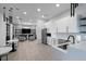 Open clubhouse area showcasing a kitchen, seating, and a TV lounge area at 6256 Springmont Loop, Palmetto, FL 34221