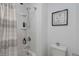 Clean bathroom showcasing a shower with a striped curtain and a white toilet at 6256 Springmont Loop, Palmetto, FL 34221