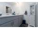 Bright bathroom boasts double sinks, gray cabinets, and a white storage cabinet at 6256 Springmont Loop, Palmetto, FL 34221