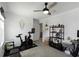 Bedroom featuring a Peloton bike, storage shelves, and ceiling fan at 6256 Springmont Loop, Palmetto, FL 34221