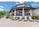 Exterior view of covered lounge area with lounge chairs and exterior finishes at 6256 Springmont Loop, Palmetto, FL 34221