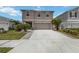 Charming two-story home with a well-maintained lawn and an inviting two car driveway at 6256 Springmont Loop, Palmetto, FL 34221
