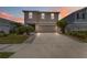 Charming two-story home with a well-maintained lawn and an inviting two car driveway at 6256 Springmont Loop, Palmetto, FL 34221