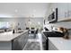 Modern kitchen seamlessly transitions to dining area, featuring stainless steel appliances at 6256 Springmont Loop, Palmetto, FL 34221