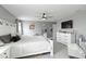 This main bedroom features calm gray walls and a white wood bed frame at 6256 Springmont Loop, Palmetto, FL 34221