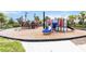 Community playground with multiple play structures and slides at 6256 Springmont Loop, Palmetto, FL 34221