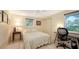 Inviting bedroom with natural light, featuring a workspace and serene views at 626 46Th St, Sarasota, FL 34234