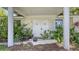 Welcoming front entrance featuring double doors, columns, and a well-maintained, landscaped garden at 626 46Th St, Sarasota, FL 34234
