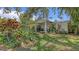 Charming single-story home with lush, tropical landscaping adding curb appeal to the property at 626 46Th St, Sarasota, FL 34234