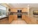 Modern kitchen with stainless steel appliances, granite countertops, and updated cabinetry at 626 46Th St, Sarasota, FL 34234
