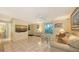 Relaxing living area with tile floors, a comfortable sofa, and ample natural light at 626 46Th St, Sarasota, FL 34234