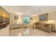 Comfortable living room with a large window, tile flooring, and stylish furnishings at 626 46Th St, Sarasota, FL 34234