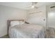 Cozy bedroom with a comfortable bed, neutral tones, and closet with white sliding doors at 718 White Pine Tree Rd # 80, Venice, FL 34285