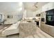 Modern kitchen with stainless steel appliances, granite countertops, and a bright, open design at 718 White Pine Tree Rd # 80, Venice, FL 34285