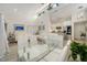 Spacious living area with high ceilings, modern lighting, and seamless transition to the kitchen at 718 White Pine Tree Rd # 80, Venice, FL 34285