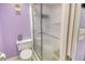 The bathroom has a toilet and shower with textured glass for privacy at 7214 Cloister Dr # 7214, Sarasota, FL 34231