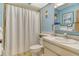 Bathroom featuring a shower, toilet, sink, and mirror with medicine cabinet at 7214 Cloister Dr # 7214, Sarasota, FL 34231