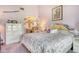Spacious primary bedroom featuring a large bed, ensuite bathroom, and natural light at 7214 Cloister Dr # 7214, Sarasota, FL 34231