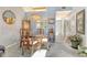Charming dining area featuring stylish chandelier, glass-top table, and a decorative cabinet at 7214 Cloister Dr # 7214, Sarasota, FL 34231