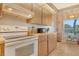 Well-equipped kitchen with appliances, a window view, and tiled floors at 7214 Cloister Dr # 7214, Sarasota, FL 34231