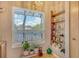 Bright kitchen with a view to the outside and decorative shelves at 7214 Cloister Dr # 7214, Sarasota, FL 34231
