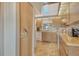 Efficient kitchen layout with a view, white appliances, and practical storage at 7214 Cloister Dr # 7214, Sarasota, FL 34231