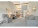 Bright living room with vaulted ceiling, an open floor plan, and natural light from large windows at 7214 Cloister Dr # 7214, Sarasota, FL 34231