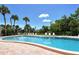 Enjoy the community pool surrounded by lush greenery and plenty of lounge chairs at 7214 Cloister Dr # 7214, Sarasota, FL 34231