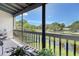 Relaxing screened porch with picturesque view of a waterway and mature trees at 7214 Cloister Dr # 7214, Sarasota, FL 34231
