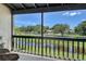 Screened porch overlooking a waterway and lush greenery, offering a tranquil view at 7214 Cloister Dr # 7214, Sarasota, FL 34231