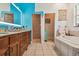 Bathroom featuring a double vanity, a soaking tub, and a separate shower room at 7264 Spencer Parrish Rd, Parrish, FL 34219