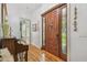 Welcoming foyer with a wood door, hardwood floors, and elegant details throughout at 7264 Spencer Parrish Rd, Parrish, FL 34219