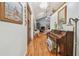 Inviting hallway featuring beautiful hardwood floors and high ceilings with a decorative chandelier at 7264 Spencer Parrish Rd, Parrish, FL 34219