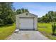 Exterior of garage with roll-up door at 7264 Spencer Parrish Rd, Parrish, FL 34219