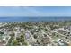 Expansive aerial view of neighborhood, showcasing proximity to water, lush greenery, and a serene environment at 7308 17Th W Ave, Bradenton, FL 34209