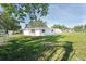 Expansive backyard featuring a well-maintained lawn and a secure chain-link fence, perfect for outdoor activities at 7308 17Th W Ave, Bradenton, FL 34209