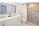 Well-lit bathroom showcases double sinks, granite countertops, modern fixtures, and a tiled shower at 7308 17Th W Ave, Bradenton, FL 34209