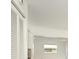Hallway displays a neutral color palette, laminate flooring and an entrance view of a bedroom at 7308 17Th W Ave, Bradenton, FL 34209