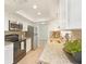 Bright kitchen features stainless steel appliances, granite countertops and white cabinetry at 7308 17Th W Ave, Bradenton, FL 34209