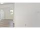 Bright and airy living room with modern gray wood-look floors, fresh white walls, and ample natural light at 7308 17Th W Ave, Bradenton, FL 34209