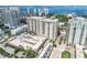 Aerial view showcasing a high-rise condo with city and waterfront views at 750 N Tamiami Trl # 1005, Sarasota, FL 34236