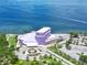 Aerial view of the Van Wezel, surrounded by trees and overlooking Sarasota Bay at 750 N Tamiami Trl # 1005, Sarasota, FL 34236