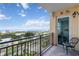 Balcony with black metal railing offers scenic views of the bay and city at 750 N Tamiami Trl # 1005, Sarasota, FL 34236