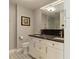 Bathroom featuring double sinks, modern fixtures, and ample storage space at 750 N Tamiami Trl # 1005, Sarasota, FL 34236