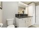 Bathroom featuring double sinks, modern fixtures, and ample storage space at 750 N Tamiami Trl # 1005, Sarasota, FL 34236