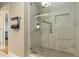 Updated bathroom with a frameless glass shower showcasing stylish tile work at 750 N Tamiami Trl # 1005, Sarasota, FL 34236