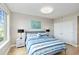 Bright bedroom featuring a large window and comfortable furnishings at 750 N Tamiami Trl # 1005, Sarasota, FL 34236